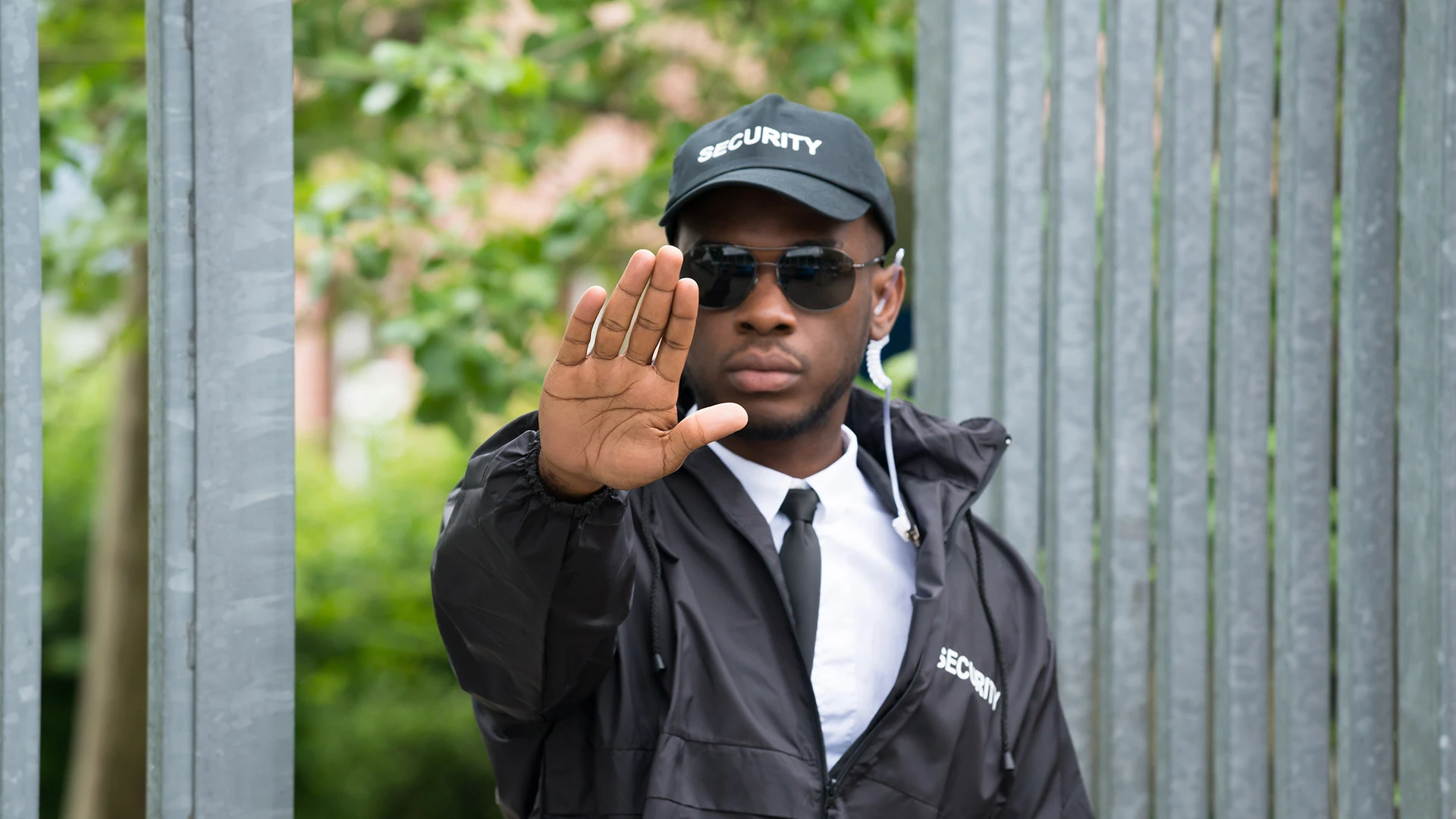 Security guard armed with his hand out in a halt position in Plant City, FL. 