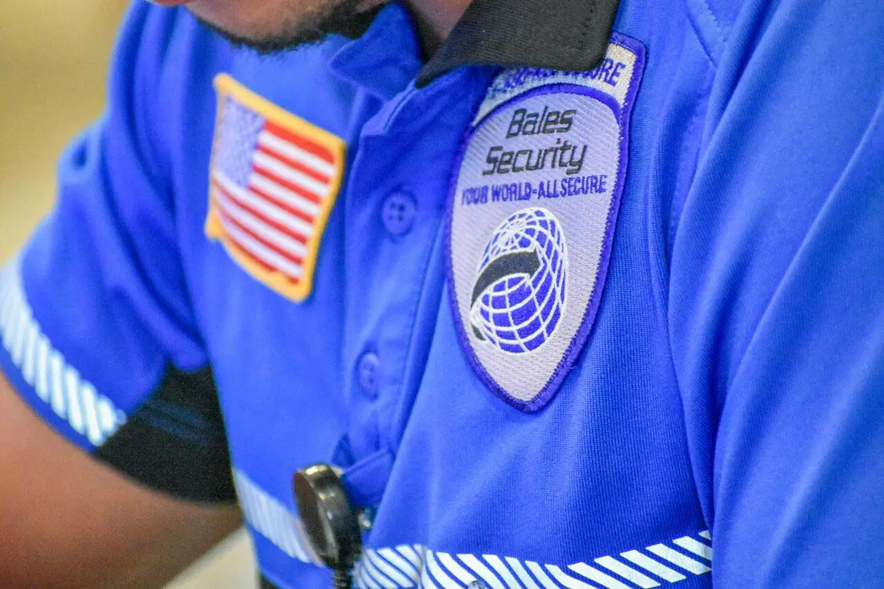 Close up photo of a security guard monitoring a shopping center in Tampa, FL.