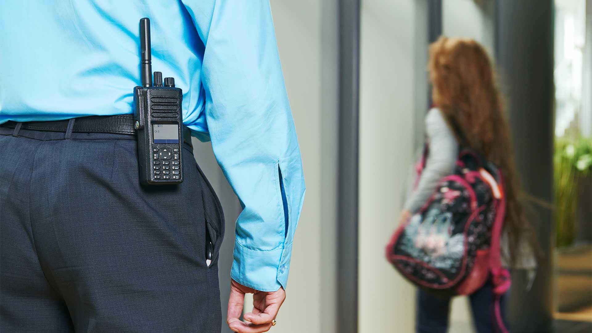 Security guard with a radio at a school in Tampa, FL.