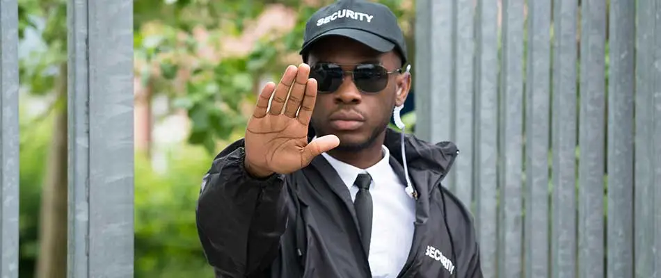 Security guard with hand up near Clearwater, FL.