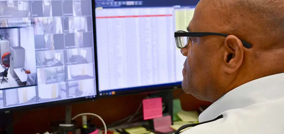 A security guard monitoring footage in Clearwater, FL.