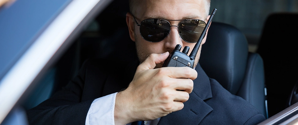 Security guard communicating over a walkie talkie in Wesley Chapel, FL.